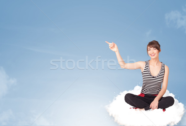 Young woman sitting on cloud with copy space Stock photo © ra2studio