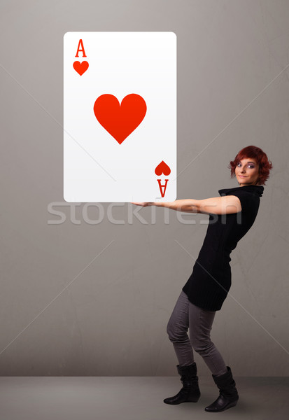 Beautifu woman holding a red heart ace Stock photo © ra2studio