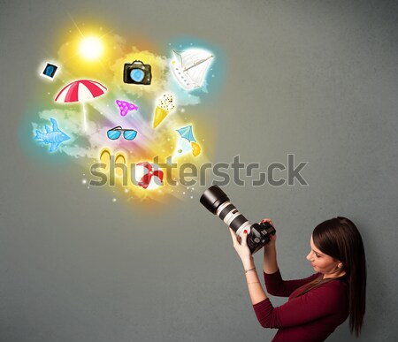 Man with airbrush spray paint with car, boat and motorcycle drawing on dark background Stock photo © ra2studio