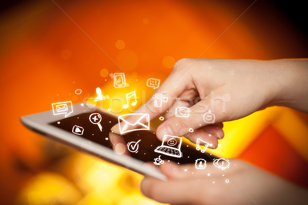 Finger pointing on tablet pc, social media concept Stock photo © ra2studio