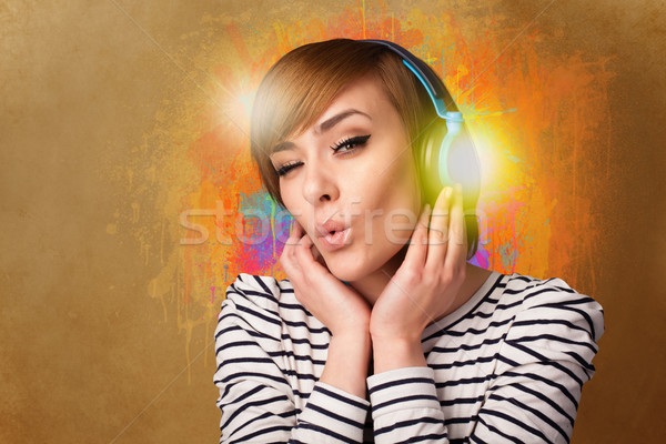 Young woman with headphones listening to music Stock photo © ra2studio