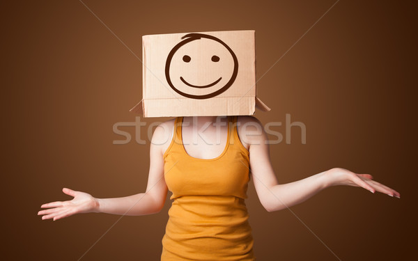 Młoda dziewczyna karton głowie uśmiech stałego Zdjęcia stock © ra2studio