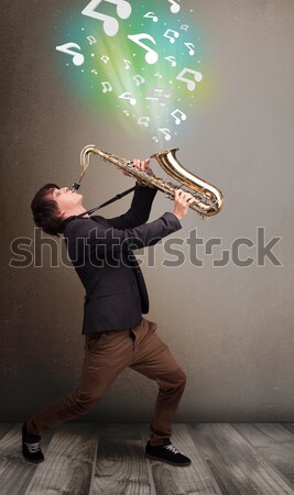 Jonge muzikant spelen saxofoon muziek merkt aantrekkelijk Stockfoto © ra2studio