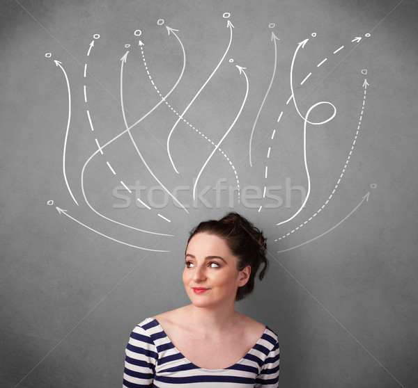 Stock photo: Young woman with arrows coming out of her head