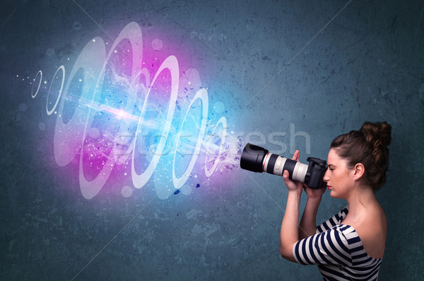 Stock photo: Photographer girl making photos with powerful light beam