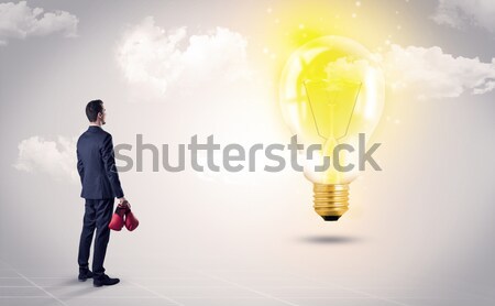 Zakenman rock berg idee lamp permanente Stockfoto © ra2studio