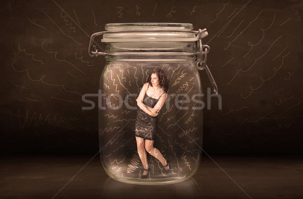 Businesswoman inside a jar with powerful hand drawn lines concep Stock photo © ra2studio