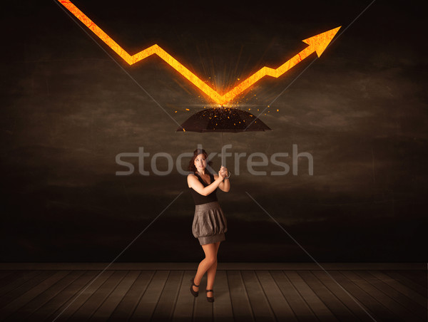 Businesswoman standing with umbrella keeping orange arrow  Stock photo © ra2studio