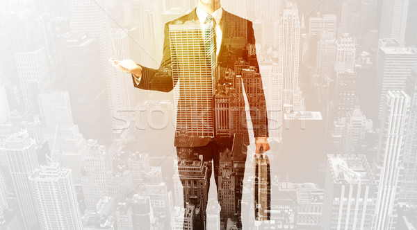 Business person with warm color overlay of city background Stock photo © ra2studio