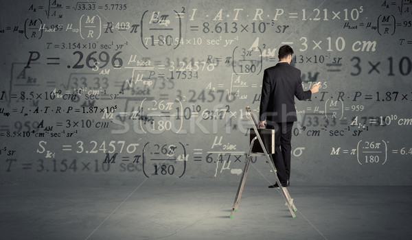 Man calculating from ladder Stock photo © ra2studio