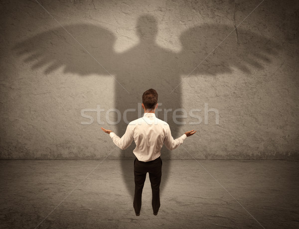 Eerlijk verkoper engel schaduw geslaagd zakenman Stockfoto © ra2studio