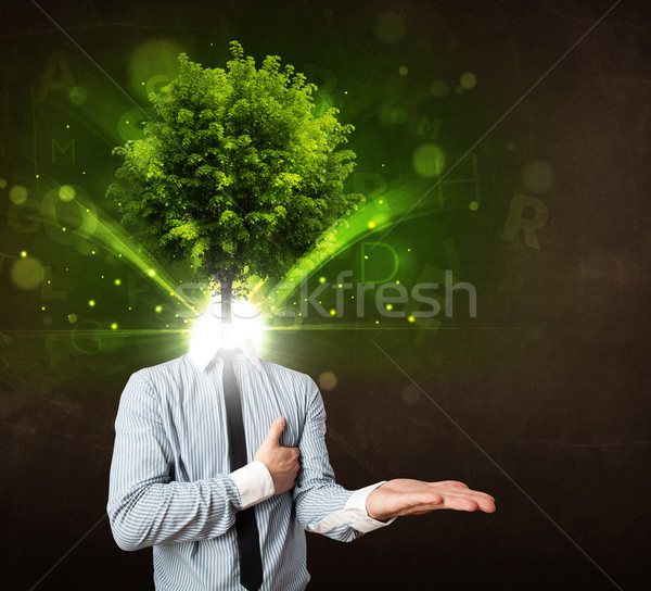 Man with green tree head concept Stock photo © ra2studio