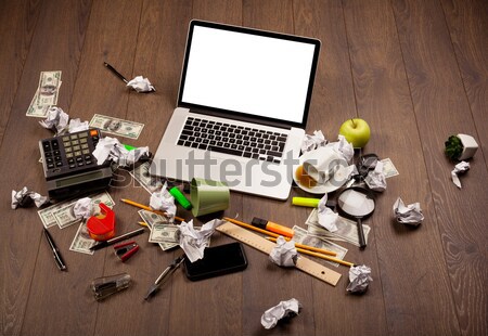 Computer desk with laptop and red arrow chart in screen Stock photo © ra2studio