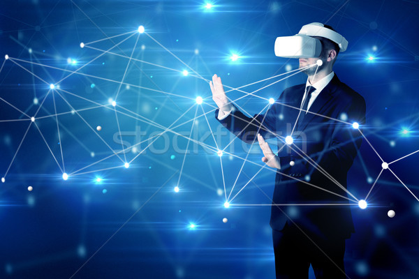 Man touching 3D connectivity and network signs Stock photo © ra2studio