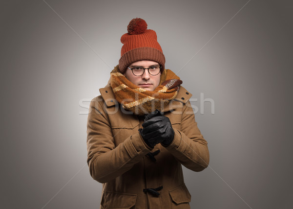 Handsome boy freezing in warm clothing Stock photo © ra2studio