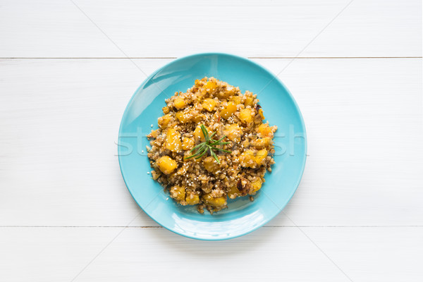 Plate of buckwheat stew with pumpkin on white table Stock photo © rafalstachura