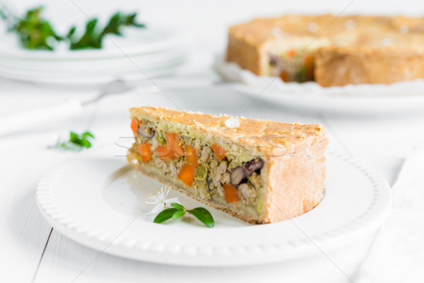 Meat-pie with carrots, red beans and peas on white plate Stock photo © rafalstachura