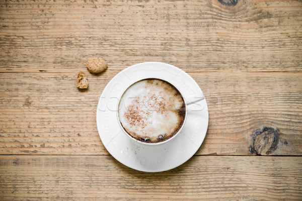 Cup of cappuccino with biscotti on woode table Stock photo © rafalstachura