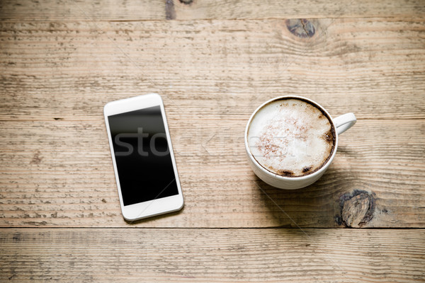 Tasse café blanche smartphone table en bois café [[stock_photo]] © rafalstachura