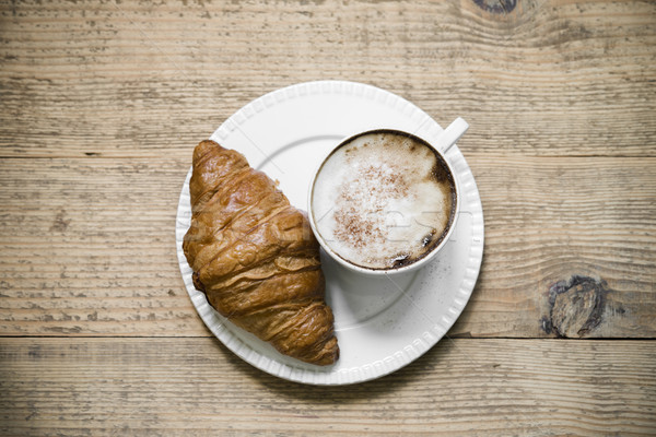 Cup of latte macchiato and croissant on wooden table Stock photo © rafalstachura
