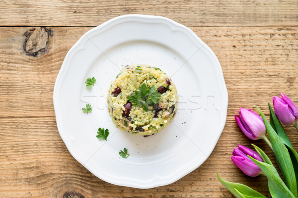 Risotto (pilaf) with jasmine rice and red beans on wooden rustic Stock photo © rafalstachura