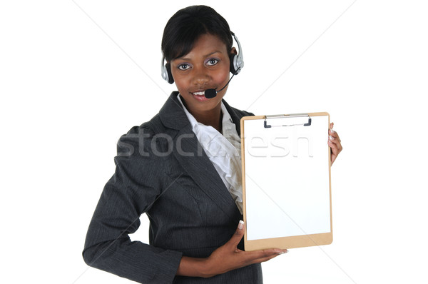 Atractiv femeie de afaceri setul cu cască clipboard izolat Imagine de stoc © RandallReedPhoto