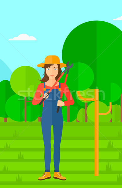 Farmer with pruner in garden. Stock photo © RAStudio