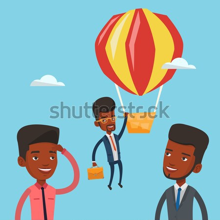 Business woman hanging on balloon. Stock photo © RAStudio
