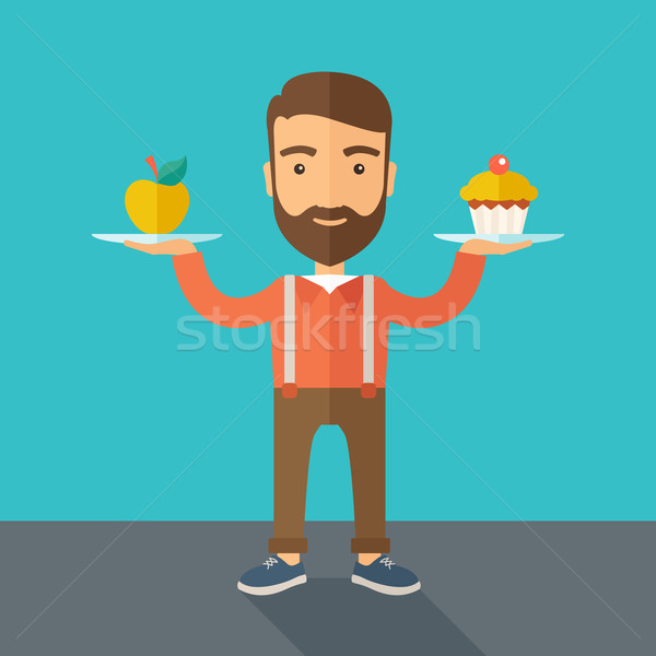 Man carries with his two hands cupcake and apple. Stock photo © RAStudio