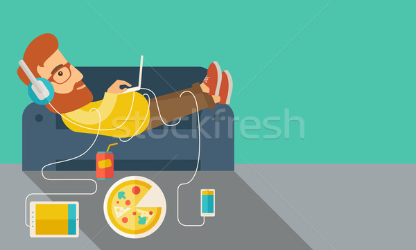 Young man lie on the sofa. Stock photo © RAStudio