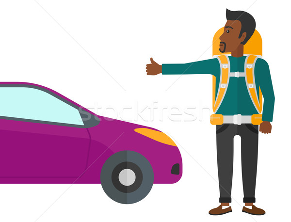 Young man hitchhiking. Stock photo © RAStudio