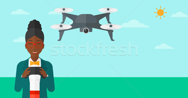 Woman flying drone. Stock photo © RAStudio
