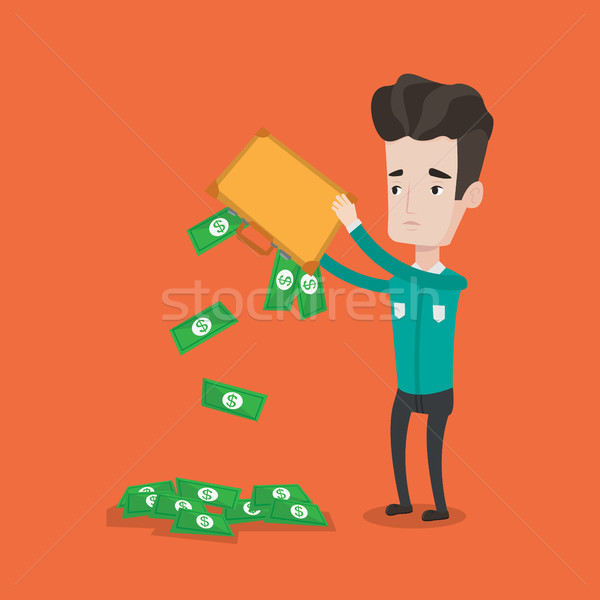 Businessman shaking out money from his briefcase. Stock photo © RAStudio