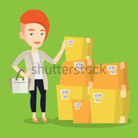 Zakenvrouw dozen magazijn werken vrouw goederen Stockfoto © RAStudio