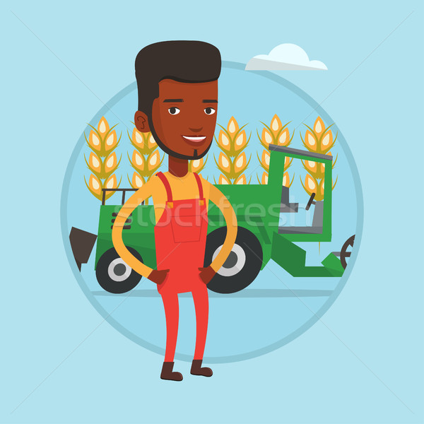 Farmer standing with combine on background. Stock photo © RAStudio