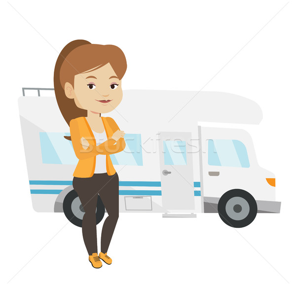 Stock photo: Woman standing in front of motor home.