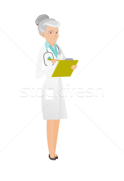 Caucasian doctor holding clipboard with documents. Stock photo © RAStudio