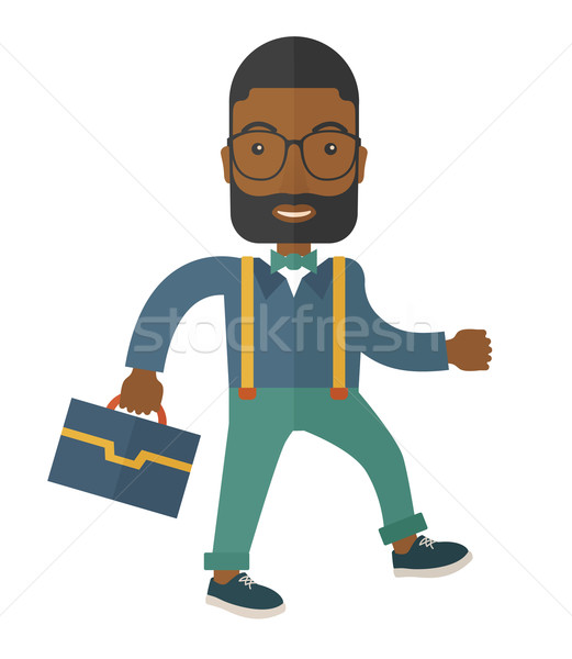 Young man walking with his briefcase. Stock photo © RAStudio