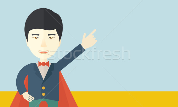Stock photo: Hero chinese man pointing up high to the sky. 