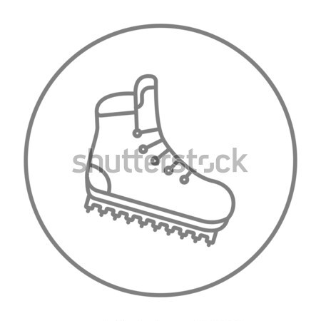 Hiking boot with crampons line icon. Stock photo © RAStudio