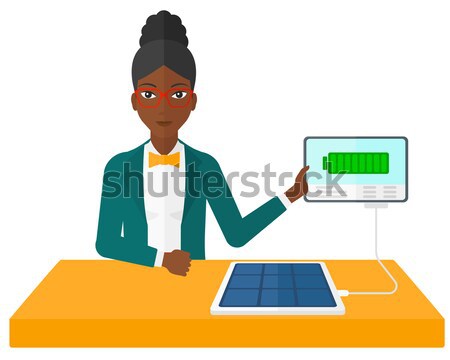 Solar panel charging tablet computer. Stock photo © RAStudio