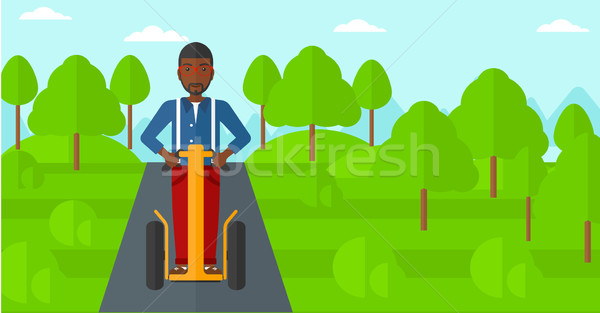 Man riding on electric scooter. Stock photo © RAStudio