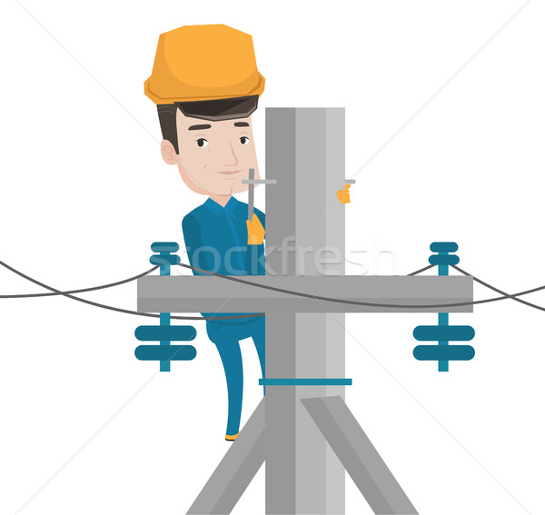 Electrician working on electric power pole. Stock photo © RAStudio