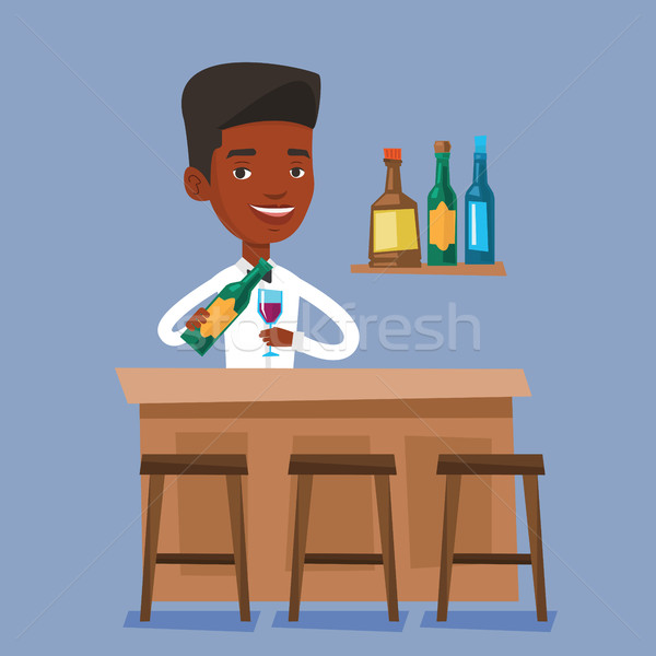 Stock photo: Bartender standing at the bar counter.