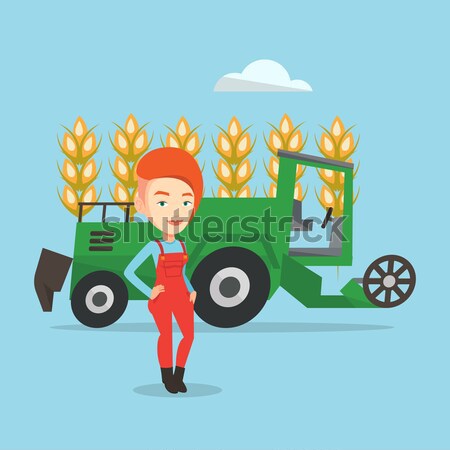 Farmer standing with combine on background. Stock photo © RAStudio