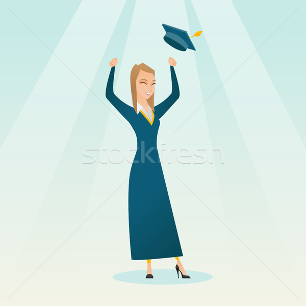 Graduate throwing up graduation hat. Stock photo © RAStudio