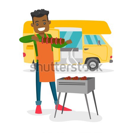 Woman having barbecue in front of camper van. Stock photo © RAStudio