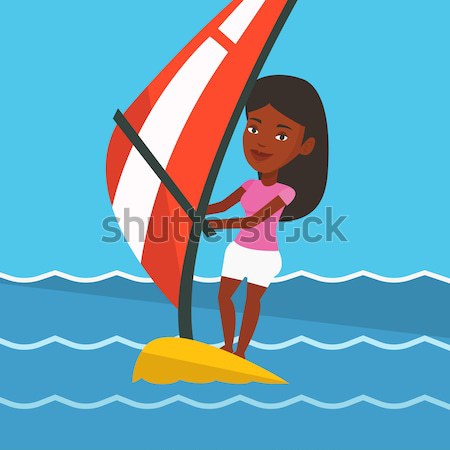 Jonge vrouw het windsurfen zee afrikaanse vrouw permanente Stockfoto © RAStudio