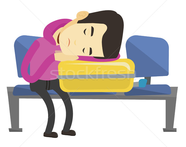Exhausted man sleeping on suitcase at airport. Stock photo © RAStudio