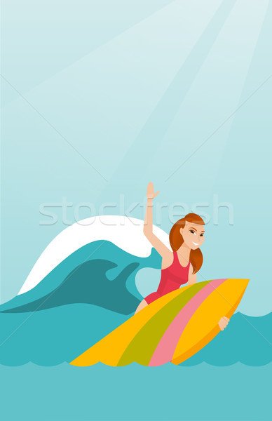 Young caucasian surfer in action on a surfboard. Stock photo © RAStudio